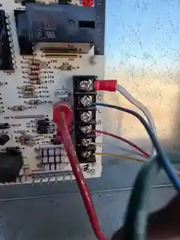 Sapper HVAC documenting rooftop package unit control wiring before detach for ProWest Roofing