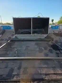 Open rooftop HVAC curb and duct connection after package unit detach for roofing access