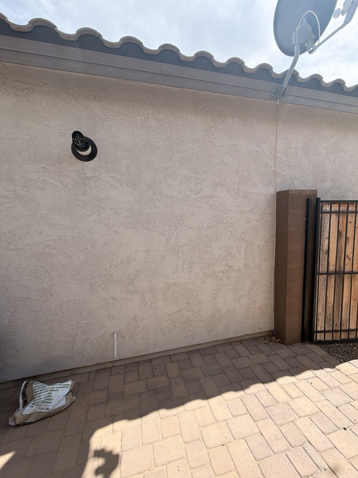 Exterior wall before garage mini split installation in Litchfield Park Arizona